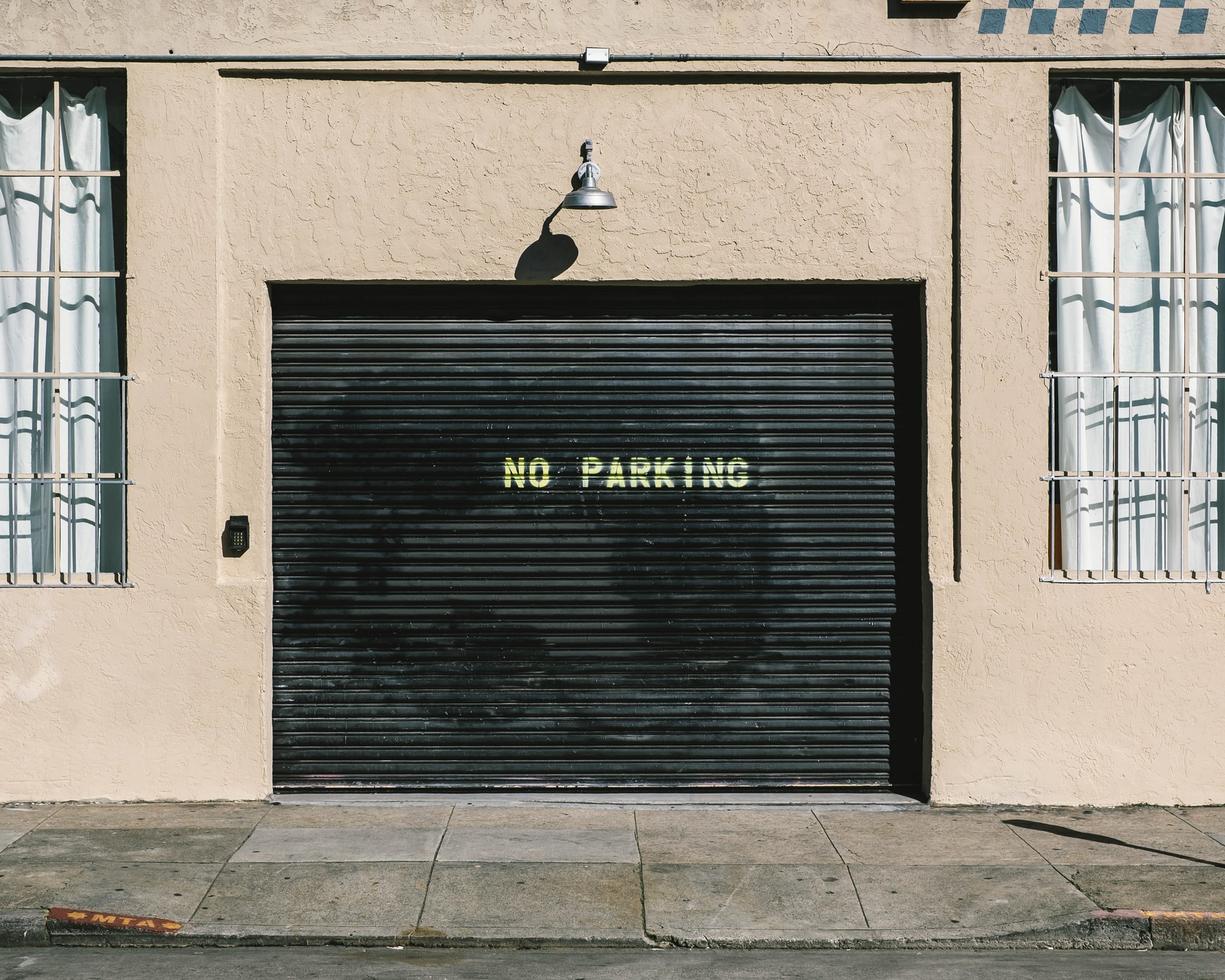 Knowing When It’s Time to Repair or Replace Your Garage Door image adam-griffith-K8QzFBCXbc4-unsplash Knowing When It’s Time to Repair or Replace Your Garage Door