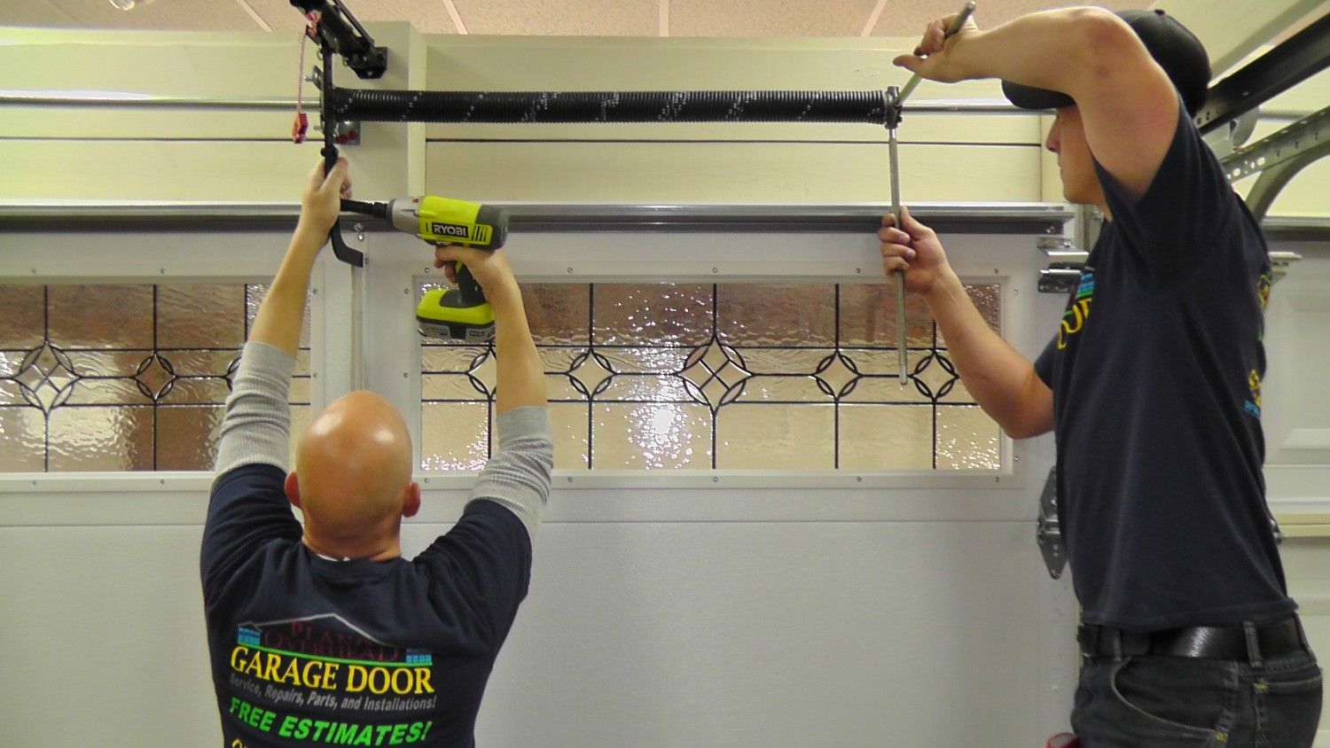 Overhead Door Repair: Why It Is Important To Hire a Professional? image installers-working Overhead Door Repair: Why It Is Important To Hire a Professional?